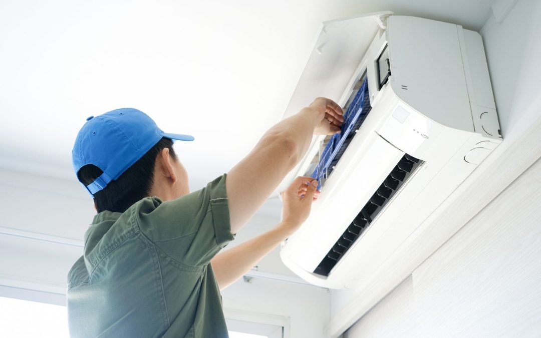 HVAC technician servicing a ductless mini split in Glendale