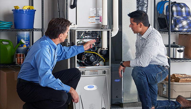 Technician evaluating a furnace for repair or replacement in Glendale
