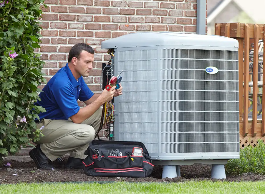 HVAC technician inspecting an outdoor AC unit in Glendale