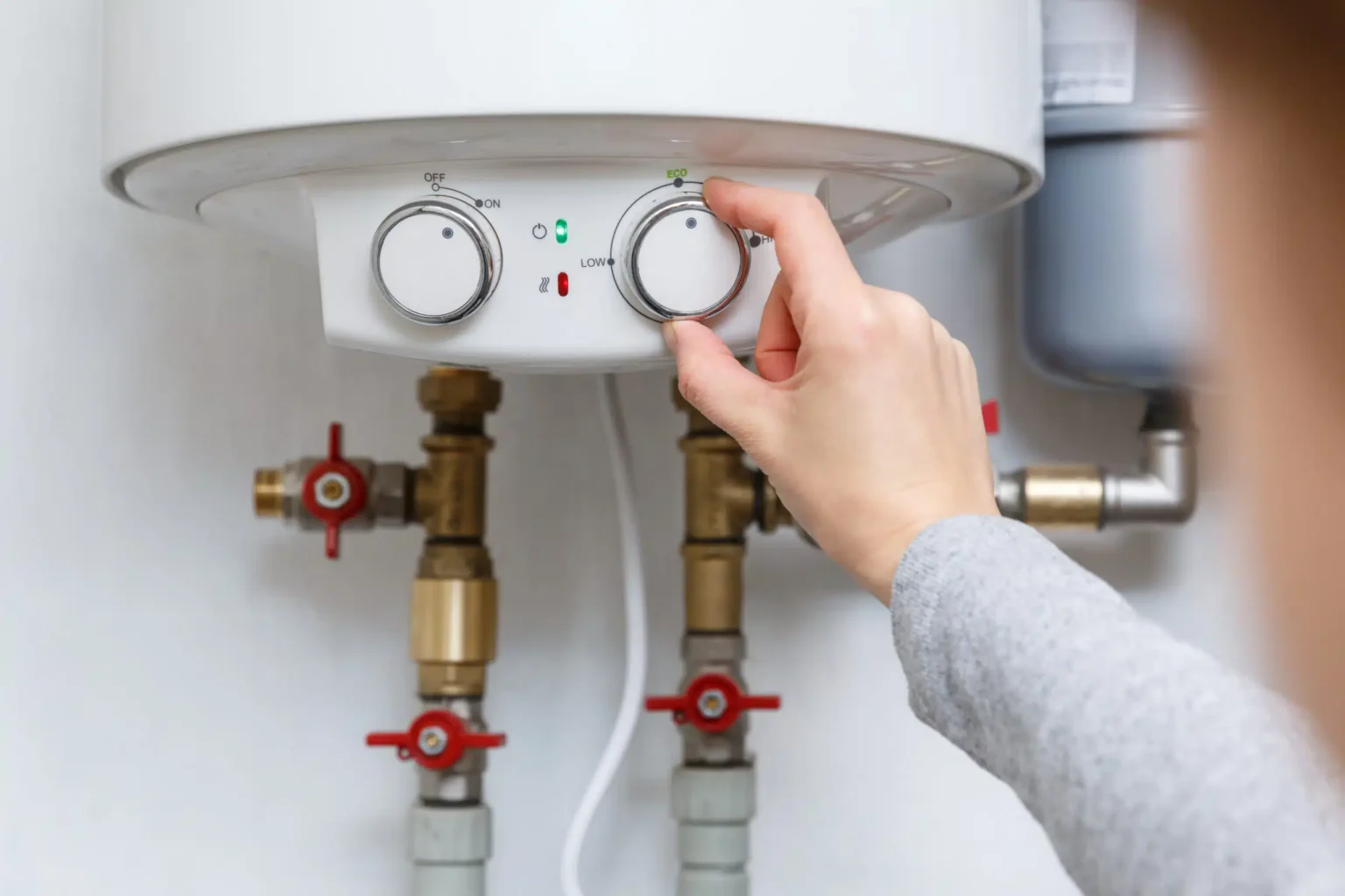Technician adjusting a water heater in Glendale